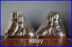 ANTIQUE TWO PART METAL CHOCOLATE MOLD PAIR of BUNNIES AROUND A BASKET OF EGGS