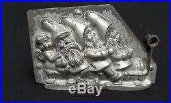 Antique Chocolate Mold 3 Dwarfs (or Santa Claus) with an Angel on a Sled