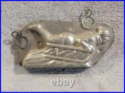 Antique Chocolate Mold by Letang of Boy Sledding Down a Hill