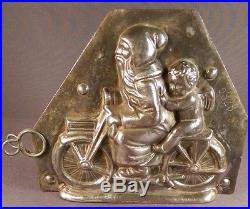 Antique German chocolate mold Santa with angel on motor cycle