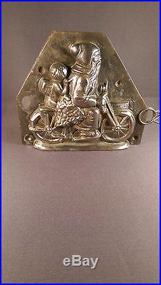 Antique German chocolate mold Santa with angel on motor cycle