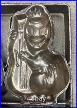 Antique metal chocolate strap cage mold 4 animals playing a bass fiddle or cello