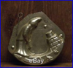 Antique two part chocolate mold Santa with lantern upon a rooftop chimney stars