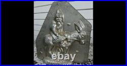 Original Antique Metal Chocolate Mold Santa with bags and riding donkey