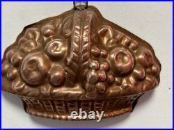 Pr antique heavy tin-lined copper baking molds in a fruit basket motif UK 19thc
