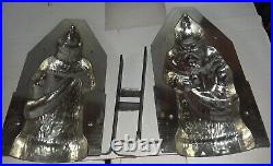 Two vintage antique metal chocolate molds Easter Bunny withbasket & St. Nick Santa